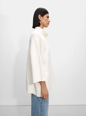 Poncho de punto con botones