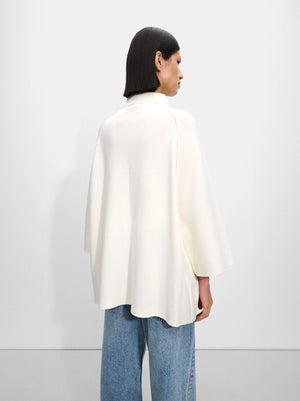 Poncho de punto con botones