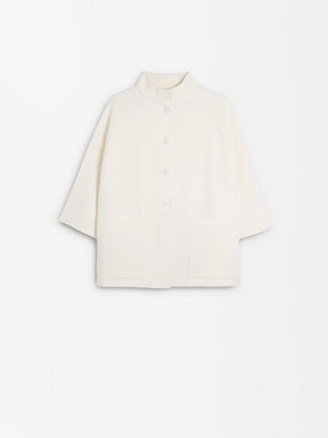 Poncho de punto con botones