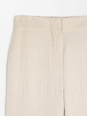 Pantalón fluido con efecto arrugado