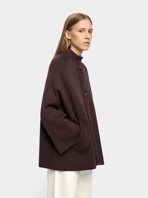 Poncho de punto con cuello alto