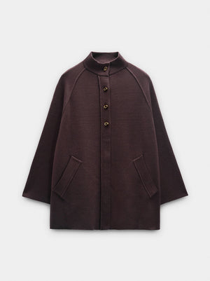 Poncho de punto con cuello alto