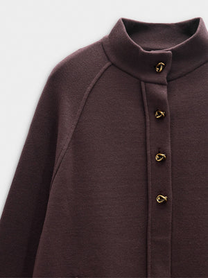 Poncho de punto con cuello alto