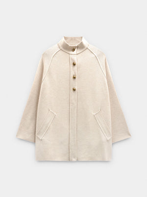 Poncho de punto con cuello alto