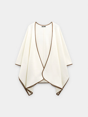 Poncho de punto con detalle de costura